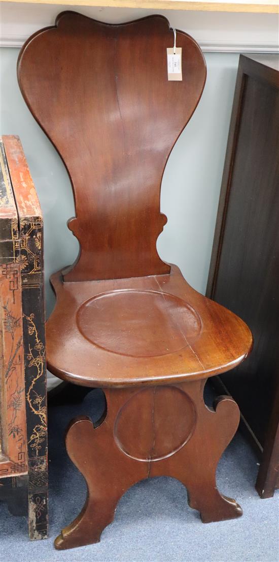 A pair of George III mahogany hall chairs